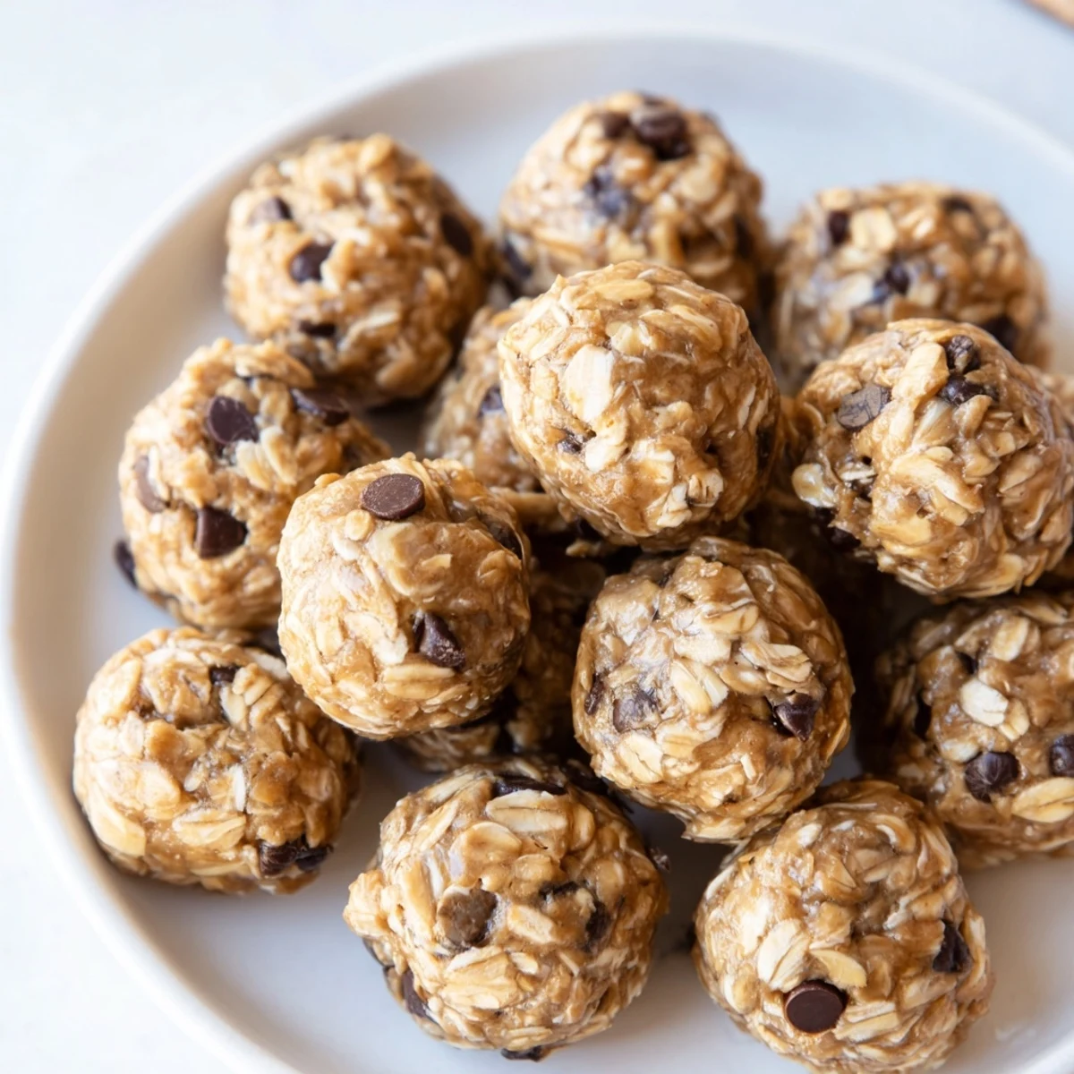 No-bake peanut butter energy balls, ready-to-eat, show a delicious mix of oats and chocolate.