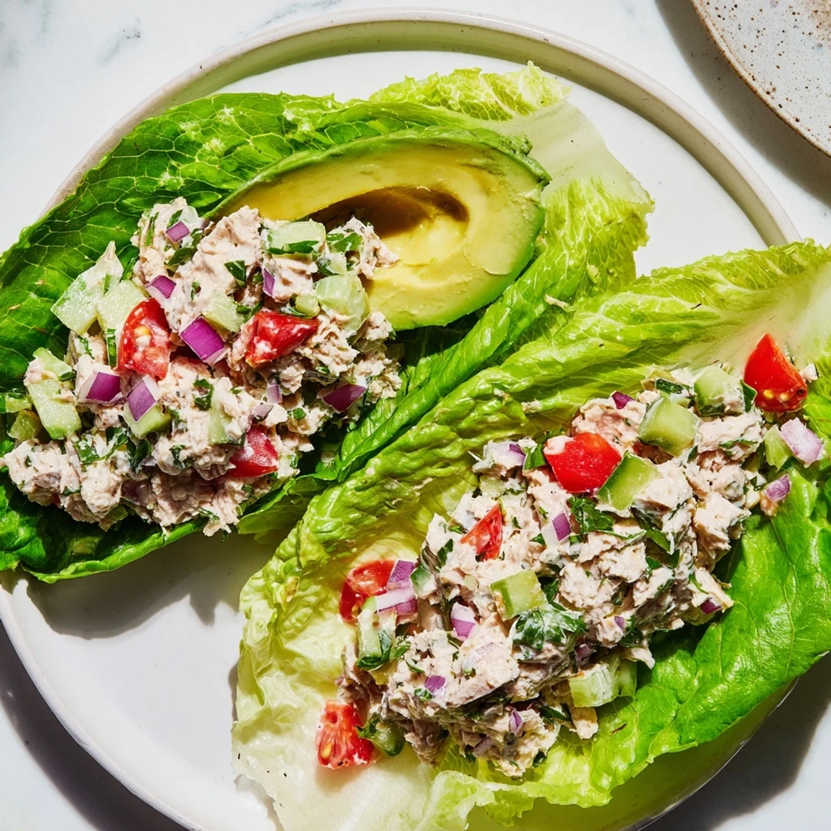 Quick & Healthy Tuna Salad Lettuce Wraps: a vibrant photo of protein-rich tuna salad with avocado, ready to eat.
