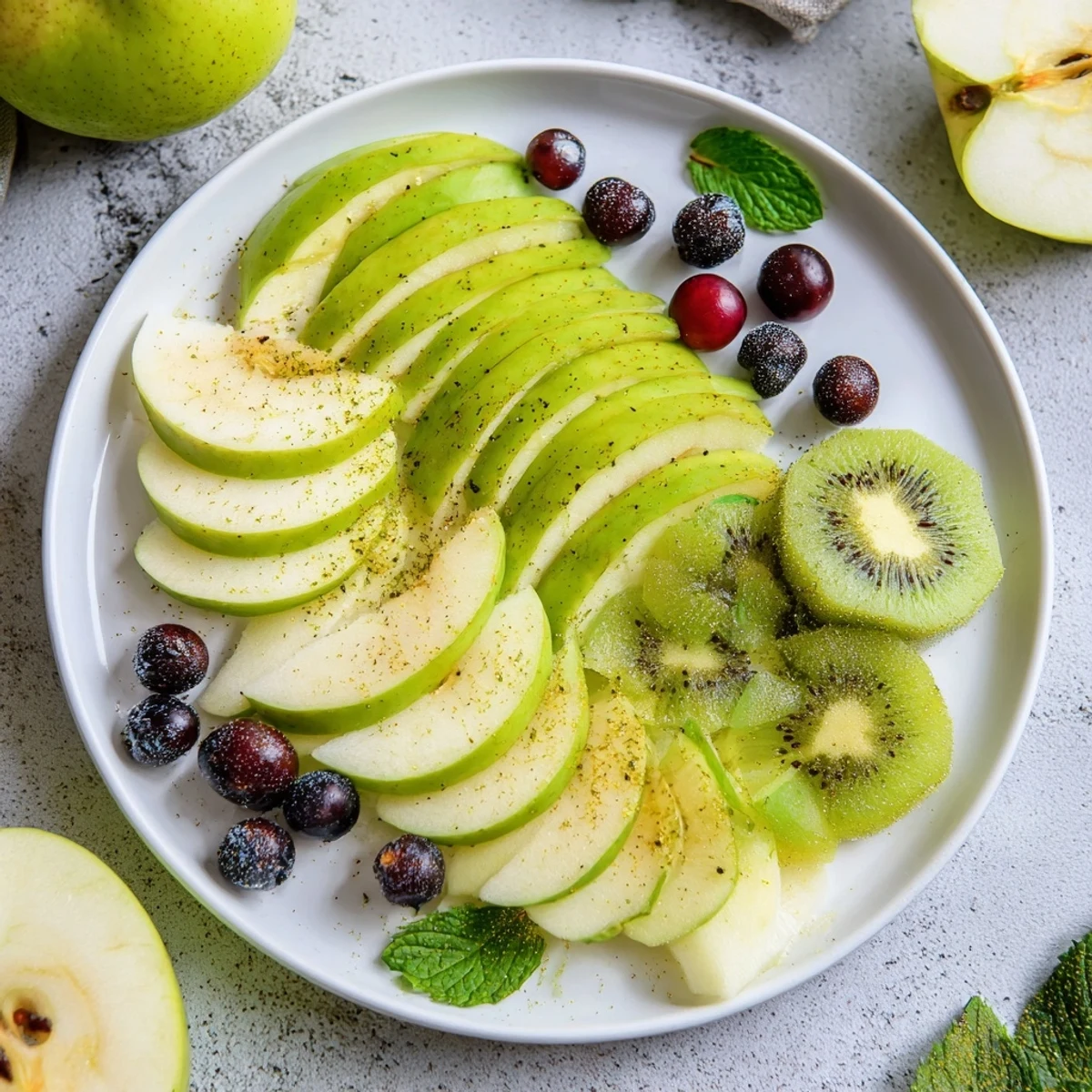 Fresh fruit arrangement of The Aurora Borealis Sweep, featuring grapes and kiwi for a beautiful vegan snack.