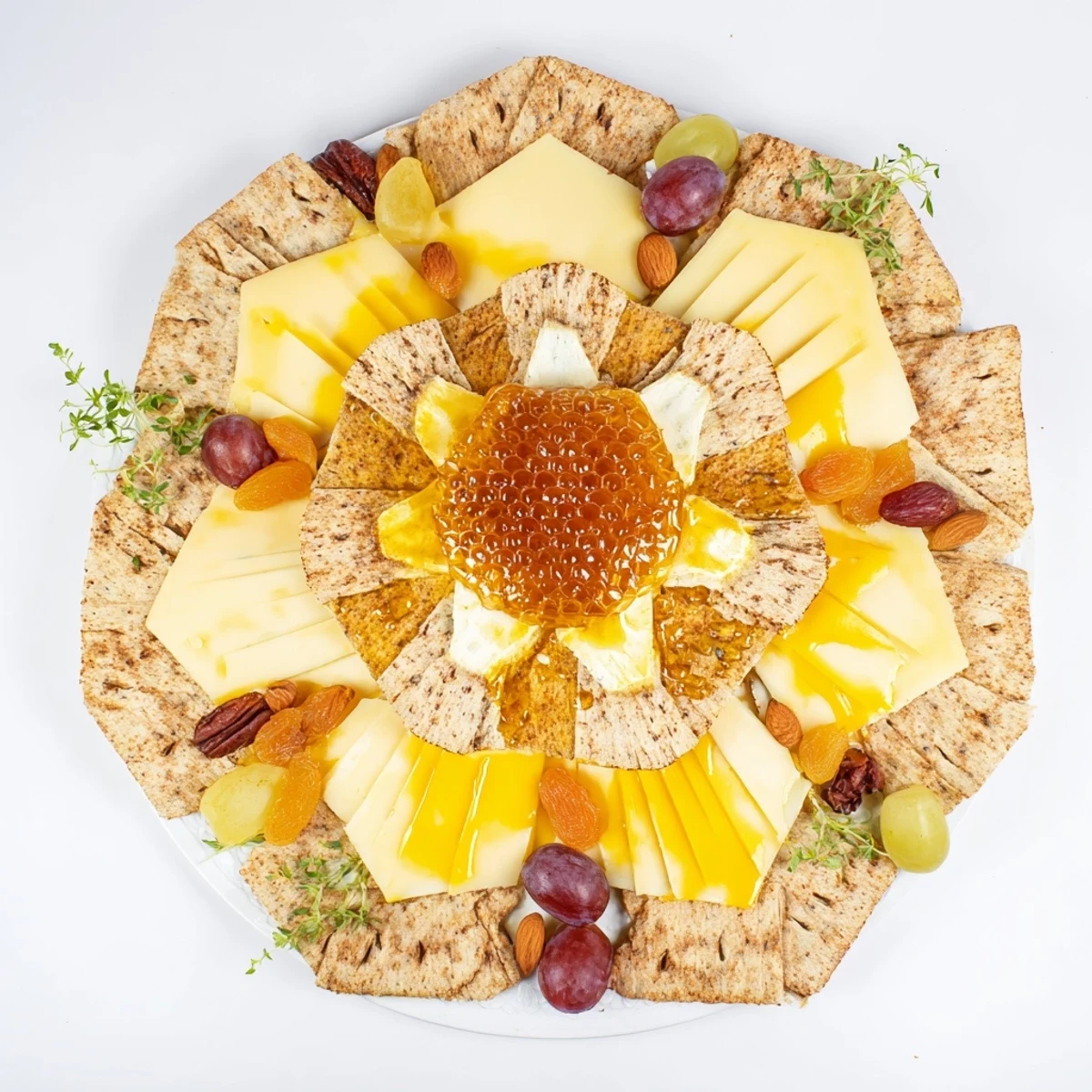 Radiant The Gilded Hive cheese board with hexagon cheeses, honeycomb, crackers, and fruits, ready to serve.