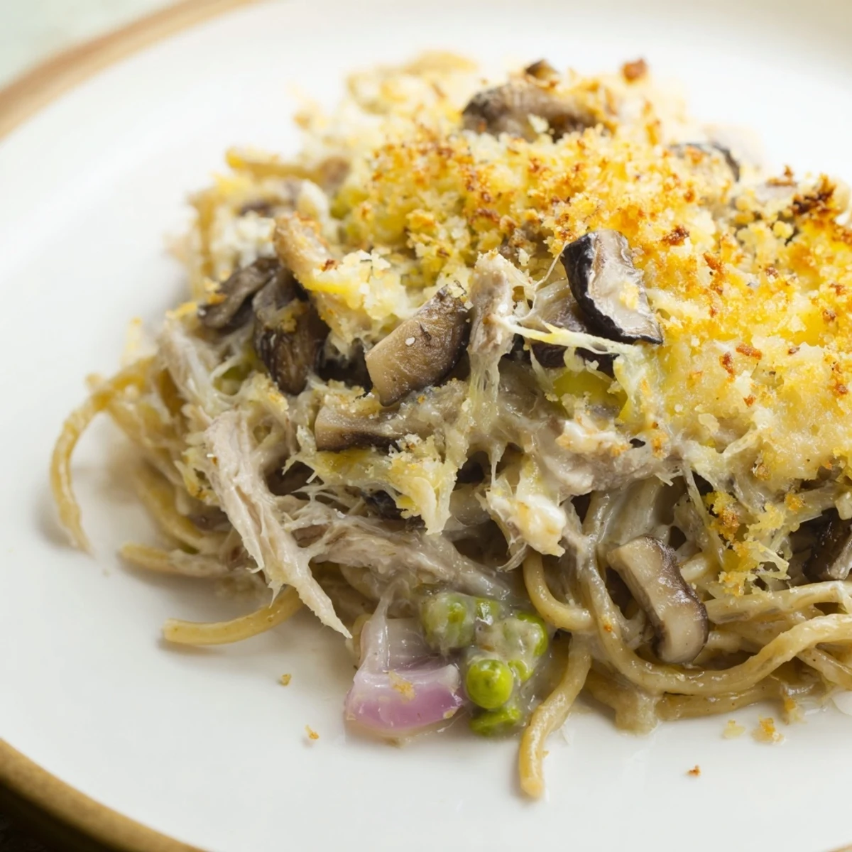 Golden-brown, bubbly Turkey Tetrazzini with a crunchy breadcrumb topping, a comforting, creamy casserole.