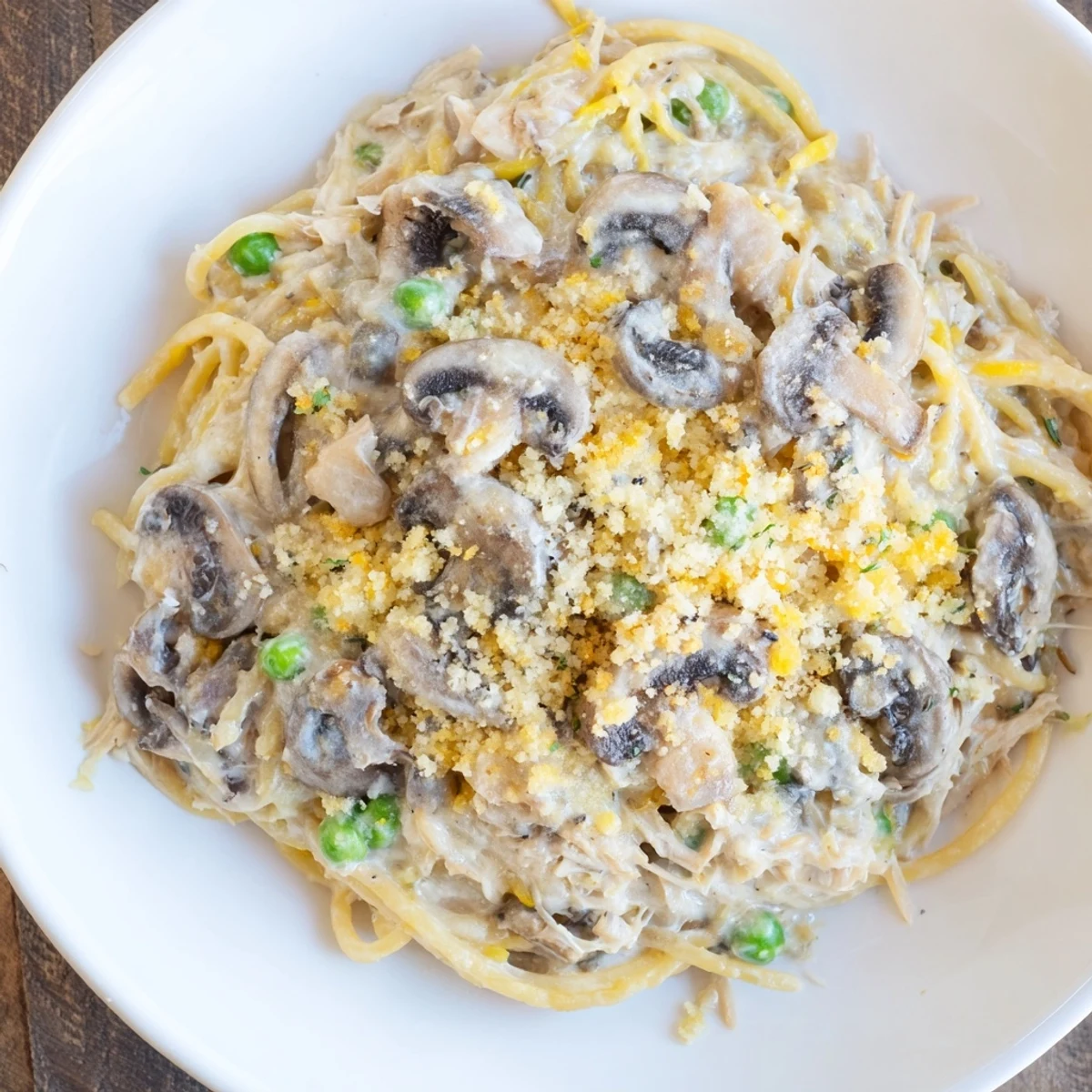 Enjoy a steaming plate of Turkey Tetrazzini, a classic American casserole brimming with savory flavors and textures.