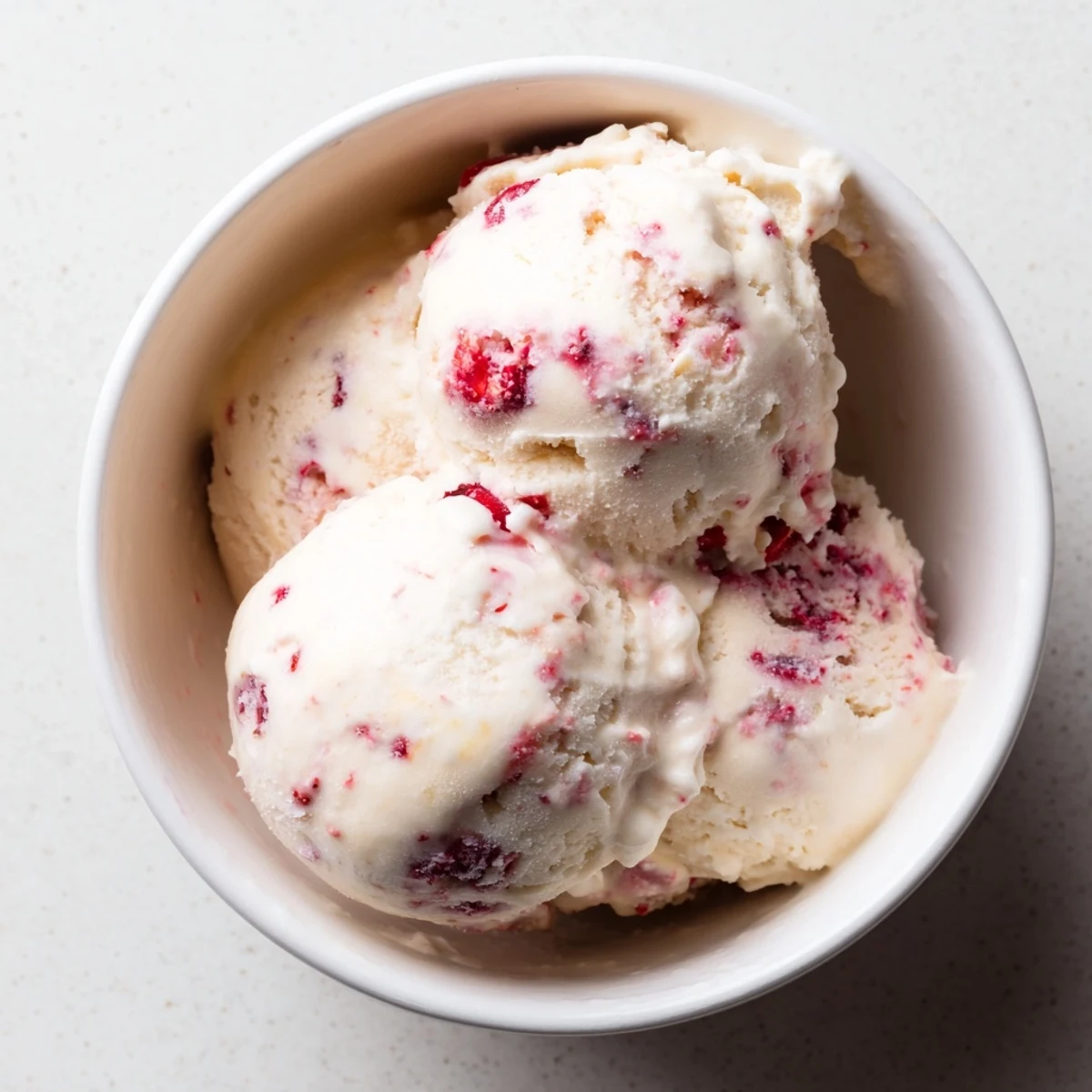 Scoops of homemade cottage cheese ice cream served, a protein-packed and naturally sweet treat.