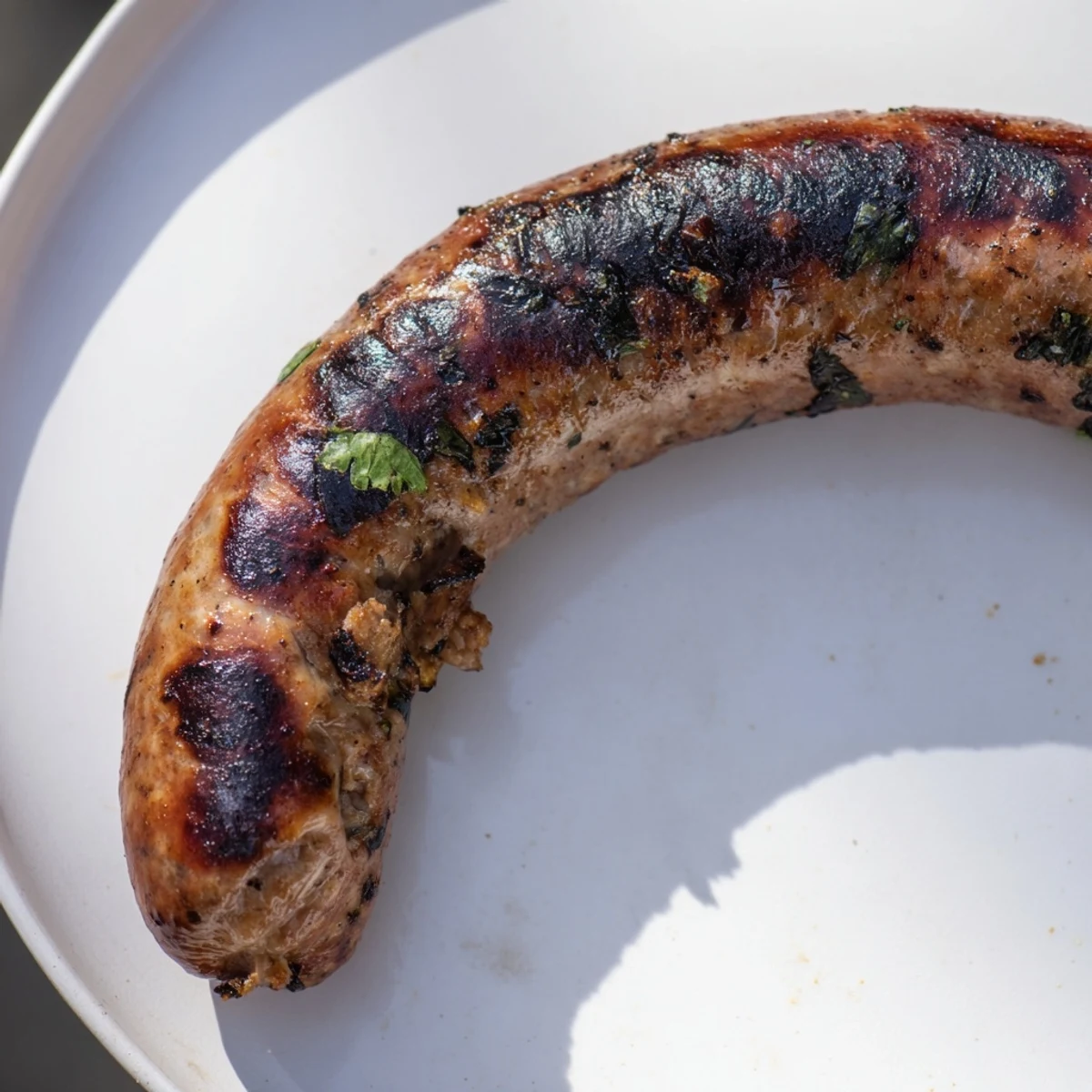 Smoky Tunisian Merguez sausages, fragrant with spices, freshly grilled, and ready for your plate.