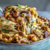 Freshly chopped cilantro garnishes a steaming bowl of Baked Ranch Turkey Chili Mac, perfect for family weeknights.