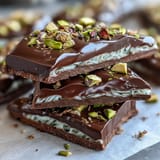 Luxurious viral Dubai chocolate bark featuring golden kataifi pastry, creamy pistachio filling, and smooth milk chocolate, perfect for Middle Eastern dessert lovers.