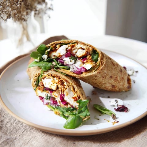 Golden Chicken and Brie Holiday Wrap, filled with melty brie and tender chicken, ready to enjoy.