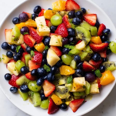 Freshly assembled refreshing fruit salad, a vibrant mix for a perfect summer treat.