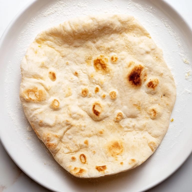 Warm, soft Three-Ingredient Flatbreads served with a Mediterranean spread; imagine the delightful, simple flavors.