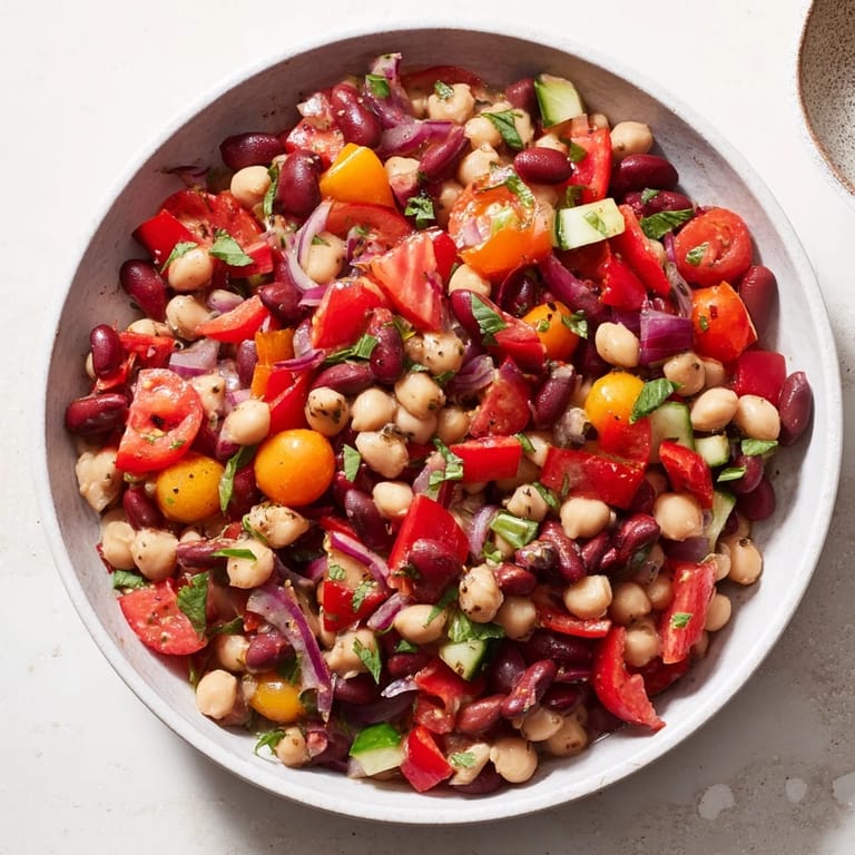 This easy Dense Bean Salad features salty prosciutto, crisp veggies, and a tangy, zesty dressing.