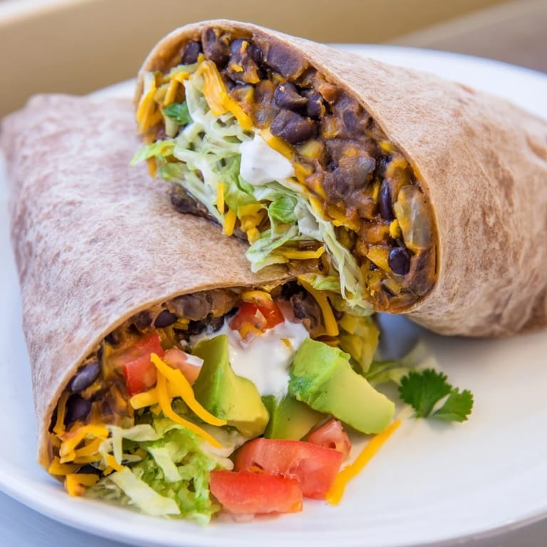 Delicious and flavorful Smoky Black Bean Burritos, packed with beans and fresh ingredients, perfect for dinner.